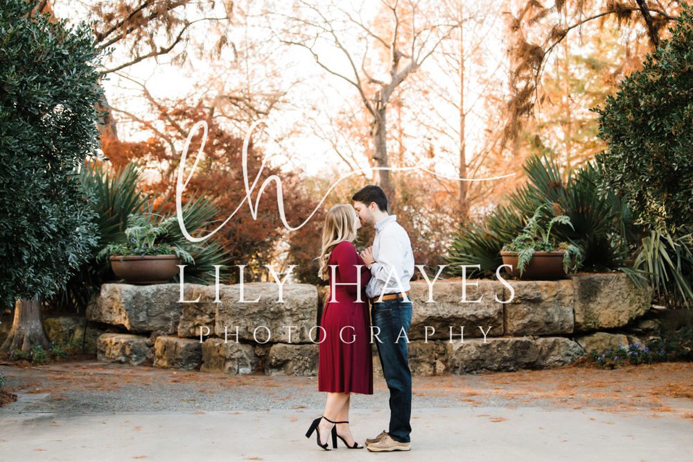 Couple kissing and posing for engagement photoshoot by lily Hayes