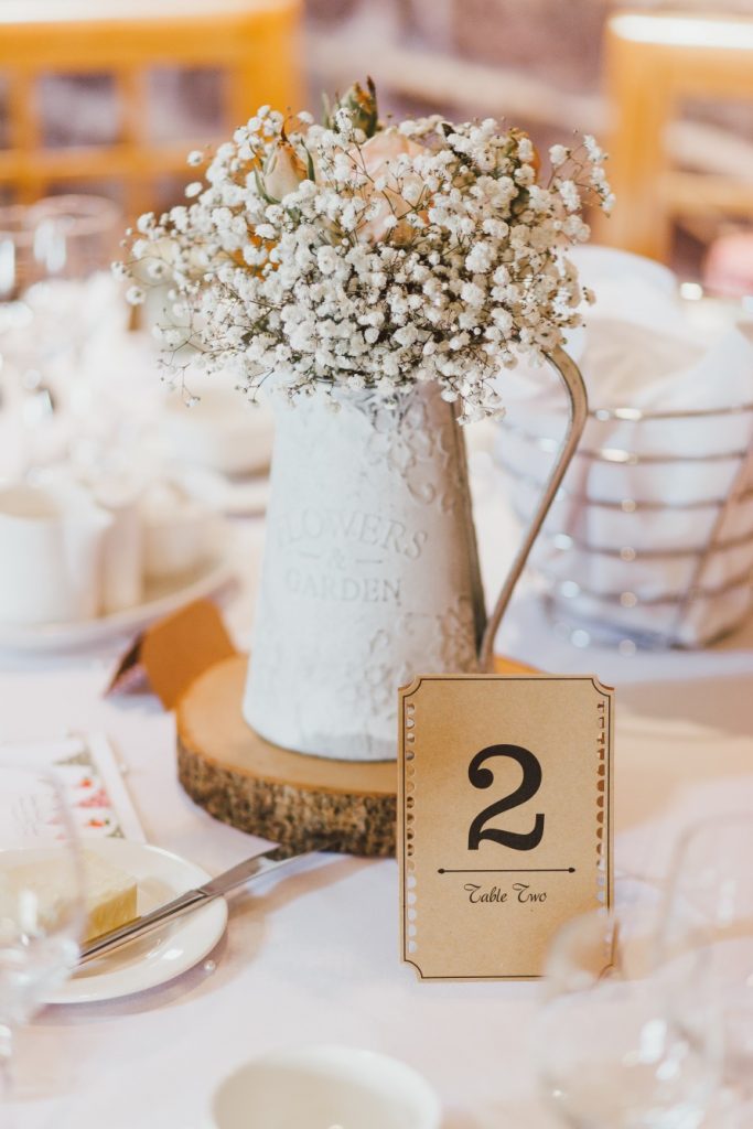 A flower arrangement on a wedding guest table